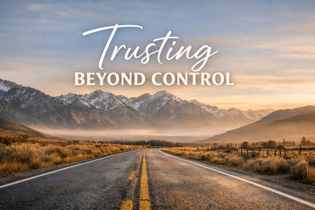 Wide-angle landscape of an open road stretching toward distant mountains under a soft sunrise sky, with the words ‘Trusting Beyond Control’ overlaid across the horizon.